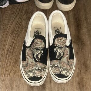 Vans Slip-On Sneakers with Black Canvas and Beige Snake Graphic